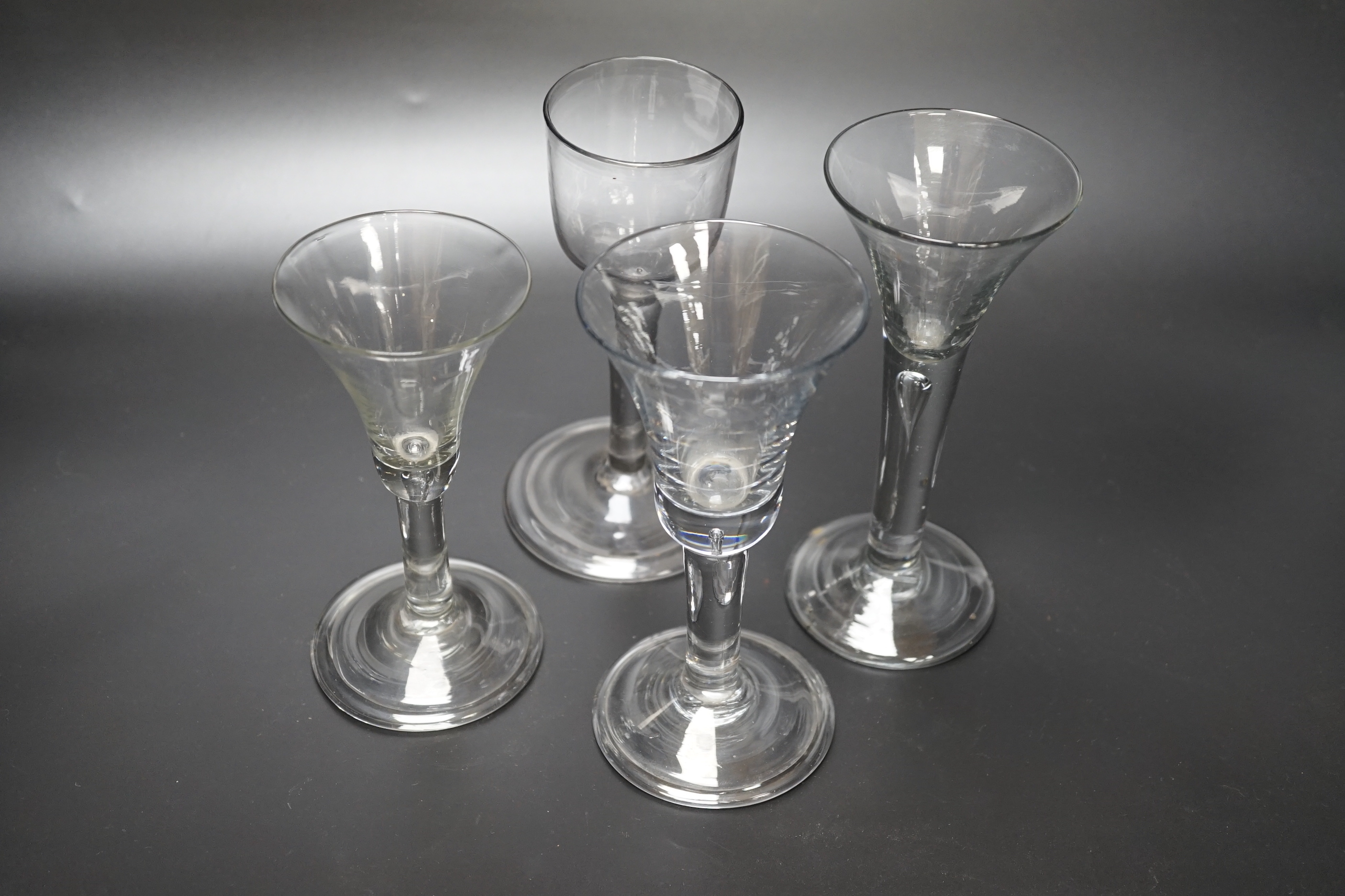 A group of four Georgian wine glasses, c.1740-50, tallest 16.8cm